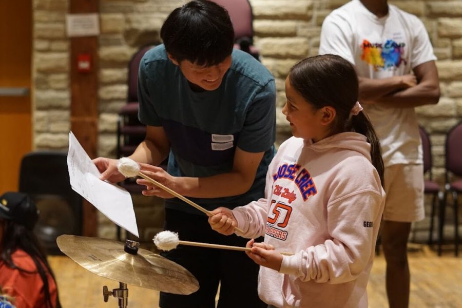 Music Mentor instructing a participant at Music Camp