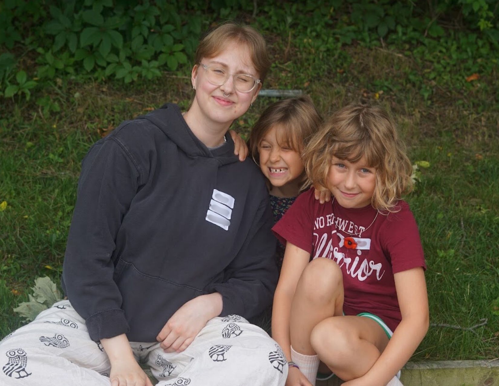 Music Mentor posing for a picture with campers at Band Camp