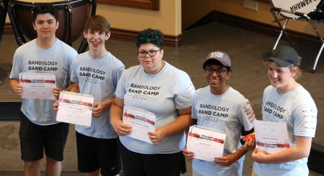 Music Mentors undergone special training holding certificates posing for a picture at Band Camp